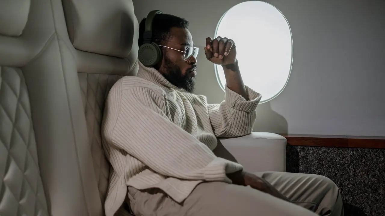Passenger Relaxing Comfortably in Airplane Seat