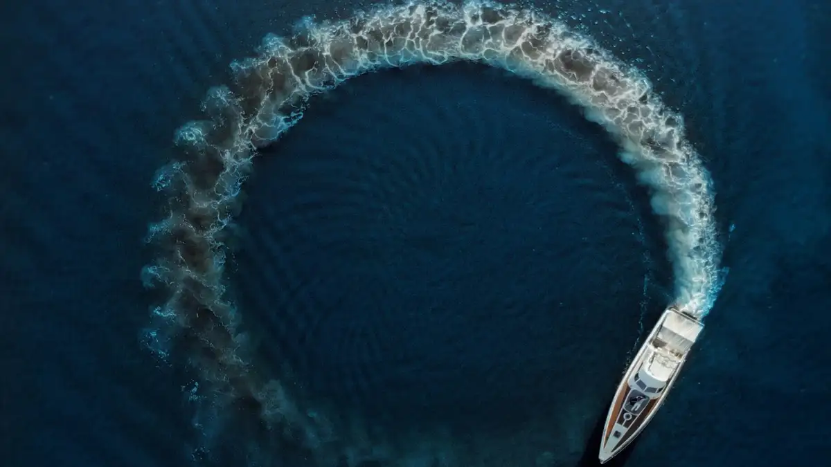 Family Kayaking on a Calm Ocean with Scenic Coastline in the Distance